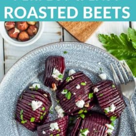 Hasselback roasted beets on a grey plate topped with goat cheese