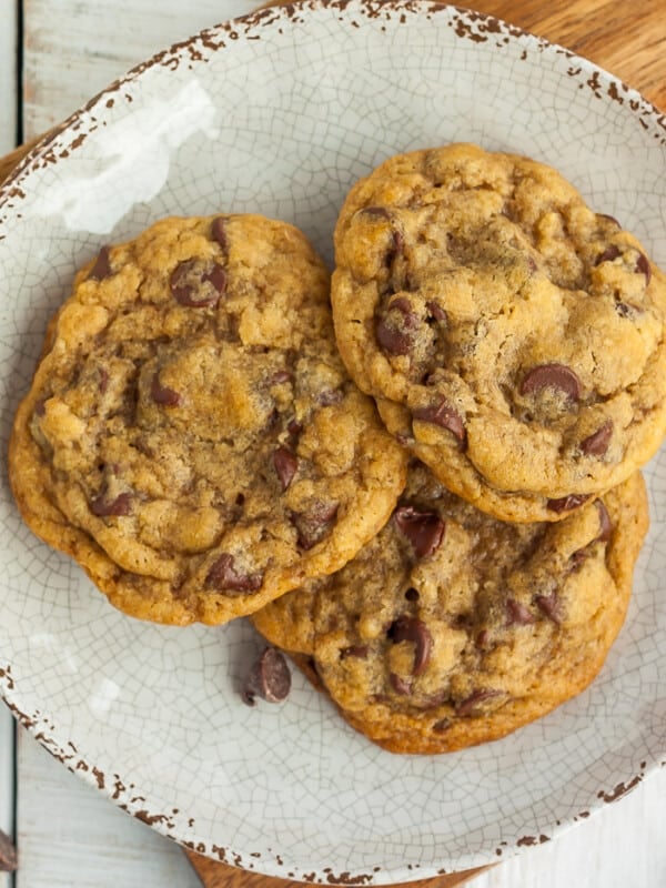 an upclose photo of 3 air fryer chocolate chip cookies on a beige plate