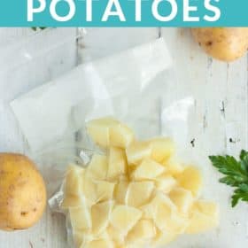 a bag of diced potatoes on a white board with whole potatoes and parsley