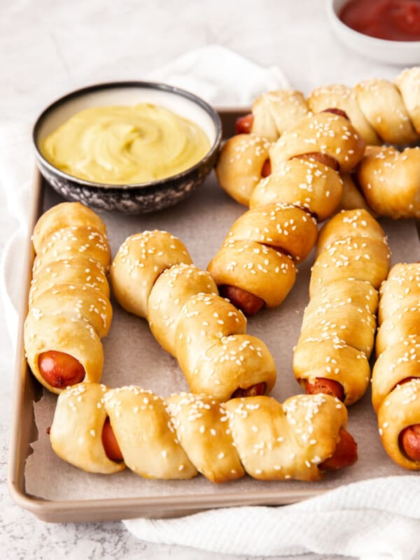 A tray of pretzel wrapped hot dogs