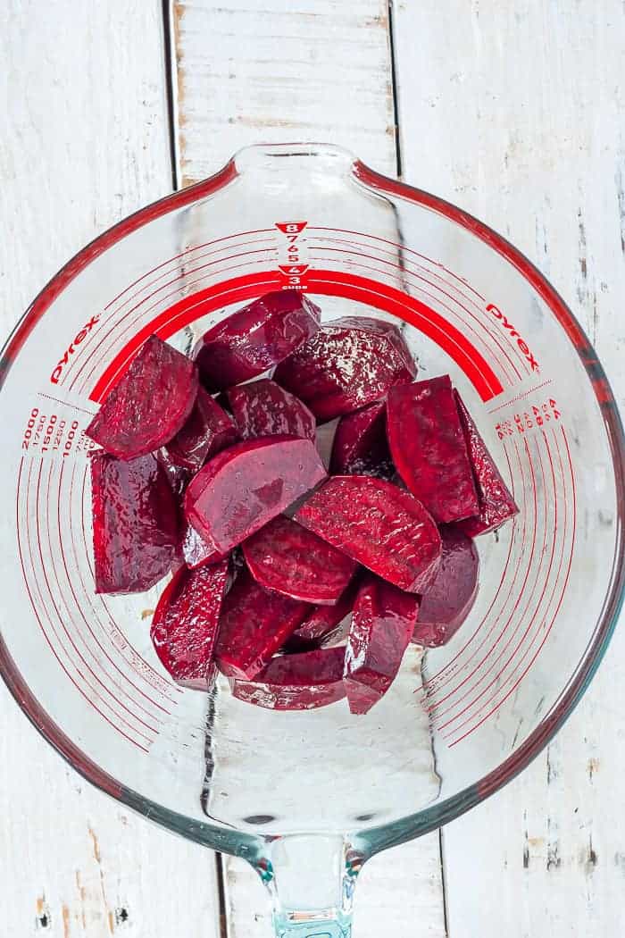 sliced beets in a glass mixing bowl