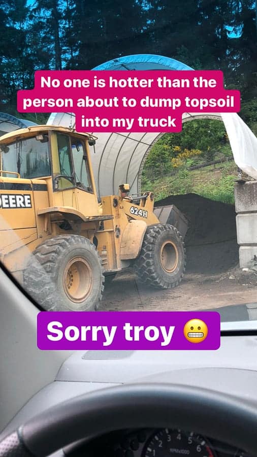 a front loader scooping dirt
