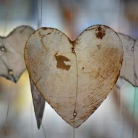 a paper heart hanging from a tree