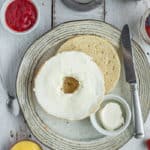 a sliced bagel on a plate
