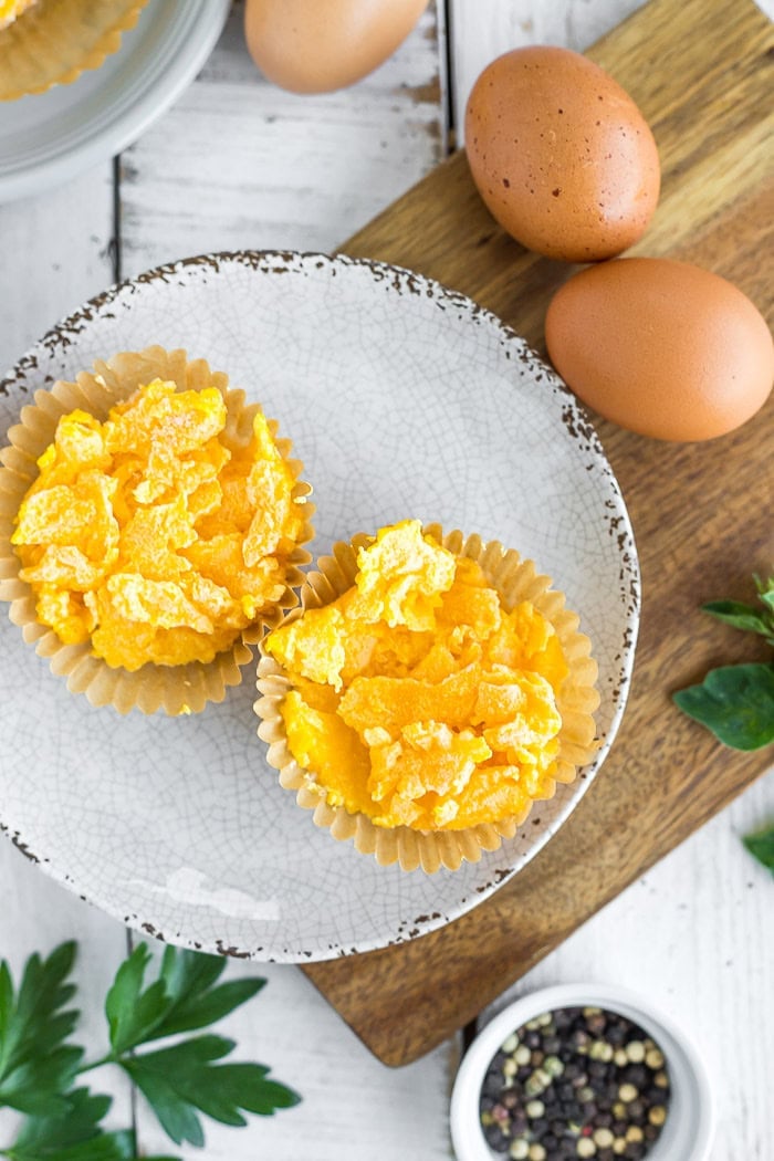 frozen egg pucks on a grey plate.