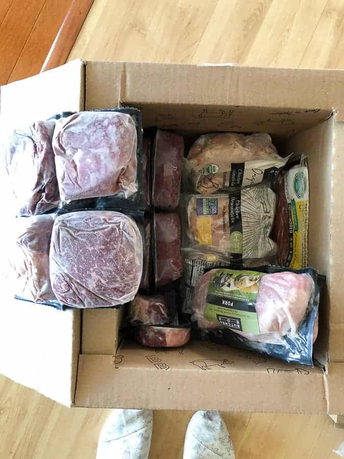 packaged meat in a cardboard box