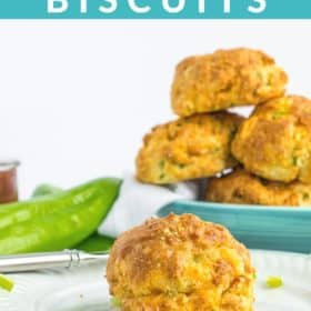 biscuits on a white with a bowl of biscuits in the background