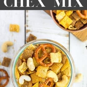 a glass bowl with Chex Mix on a white board