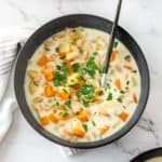 a spoon in a bowl of vegetarian soup