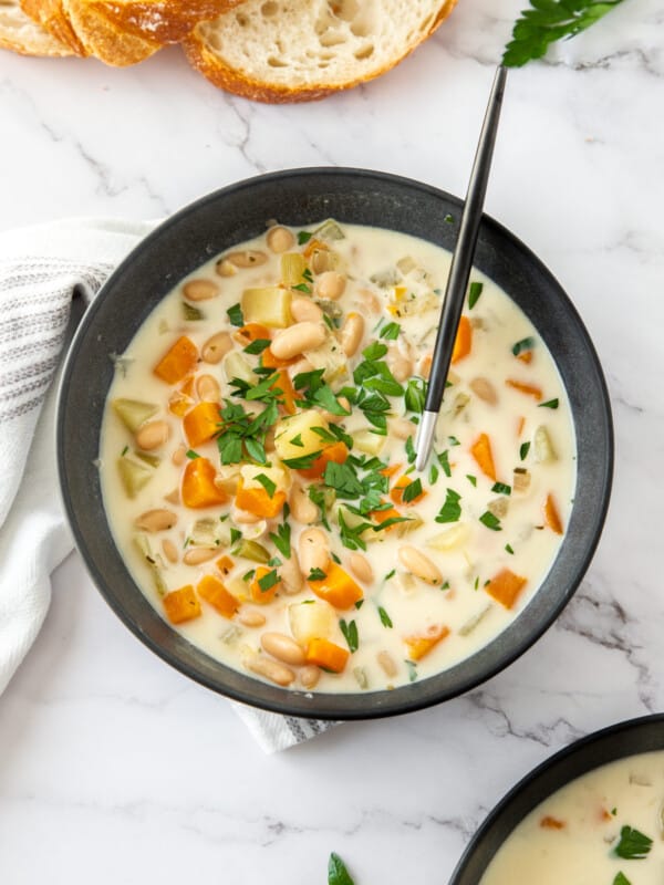 a spoon in a bowl of vegetarian soup