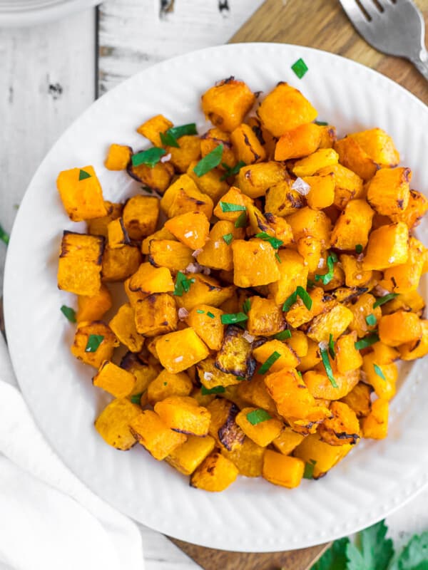 crispy air fryer butternut squash on a white plate