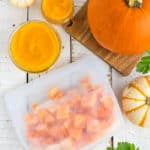 a bag of cubed frozen pumpkin with mini pumpkins