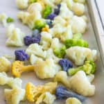 a baking sheet with frozen cauliflower