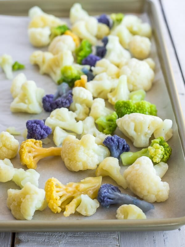 a baking sheet with frozen cauliflower