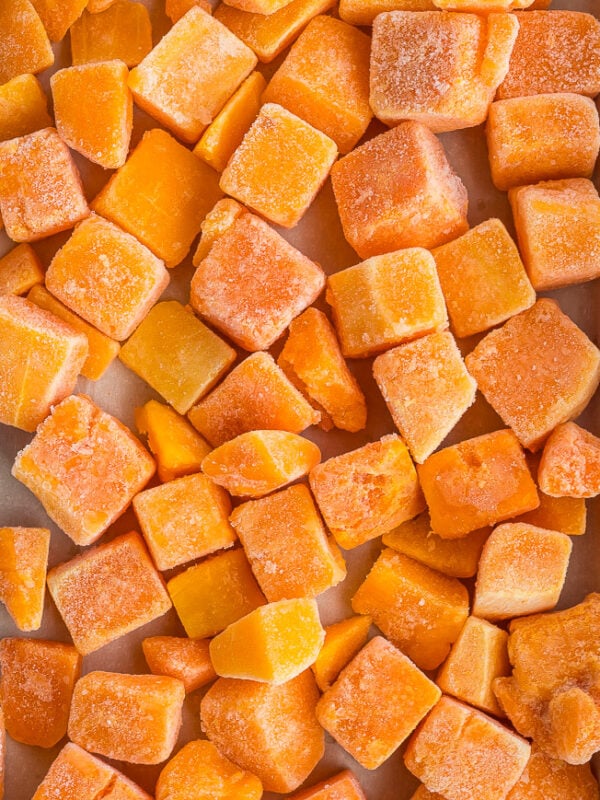 cubes of frozen pumpkin on a baking sheet.