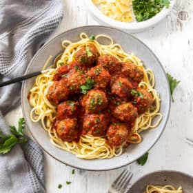 a plate with spaghetti topped with air fryer meatballs
