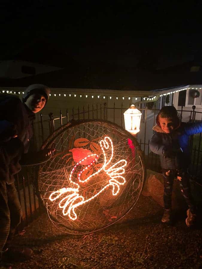 a crab pot decorated with christmas lights