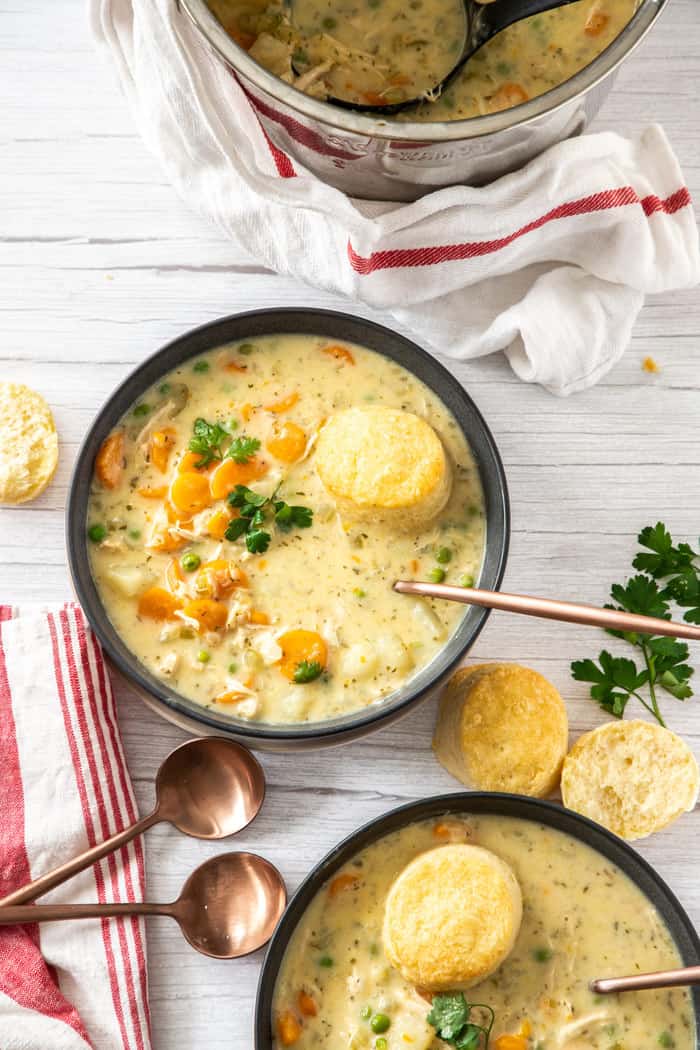 2 bowls of chicken pot pie with biscuits and herbs