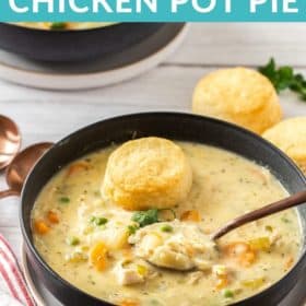 a black bowl with a spoon full of Instant Pot chicken pot pie