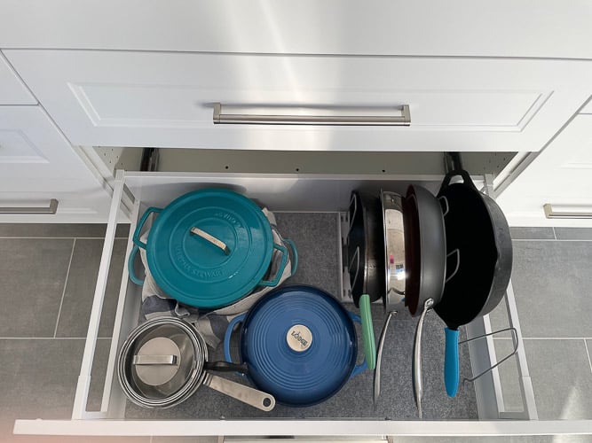 pots and pans in a kitchen drawer