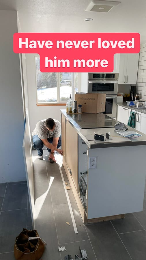a man working on a kitchen remodel