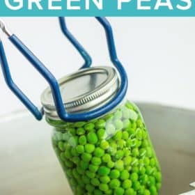 canning tongs holding a jar of peas