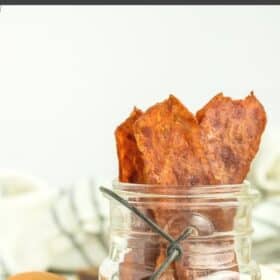 a canning jar with turkey bacon standing up in it