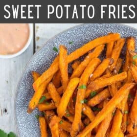 frozen sweet potato fries in an air fryer on a plate