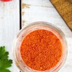 a glass canning jar of homemade tomato powder