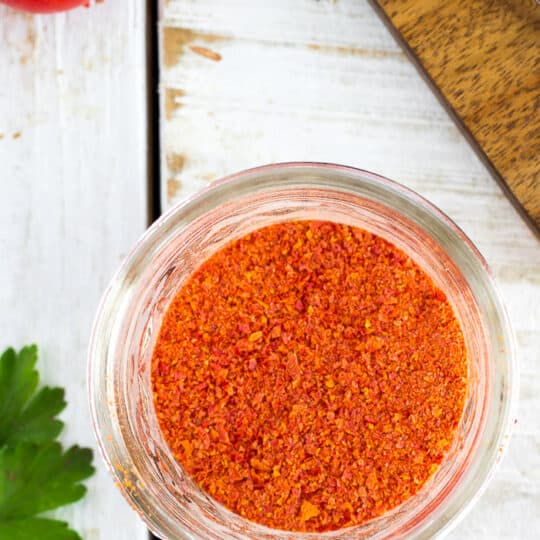 a glass canning jar of homemade tomato powder