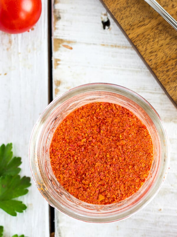 a glass canning jar of homemade tomato powder