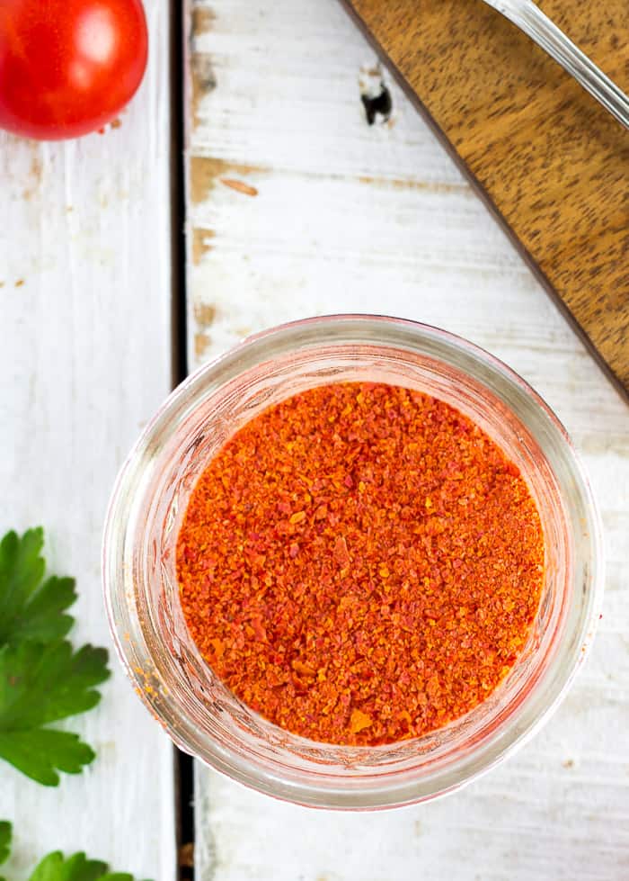 a glass canning jar of homemade tomato powder