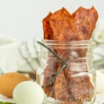a canning jar with turkey bacon standing up in it