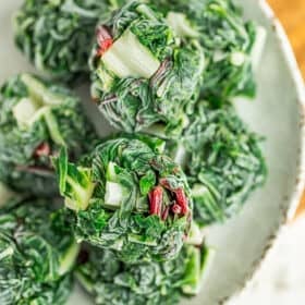 frozen pucks of swiss chard on a beige plate