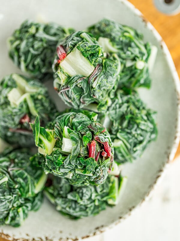 frozen pucks of swiss chard on a beige plate