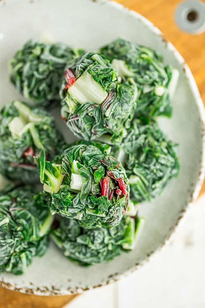 frozen pucks of swiss chard on a beige plate