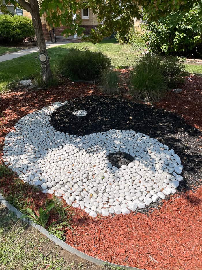 a yin yang made out of rocks