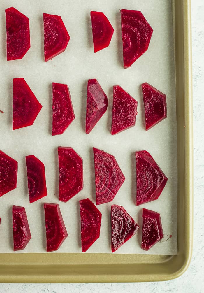 sliced beets on a baking sheet