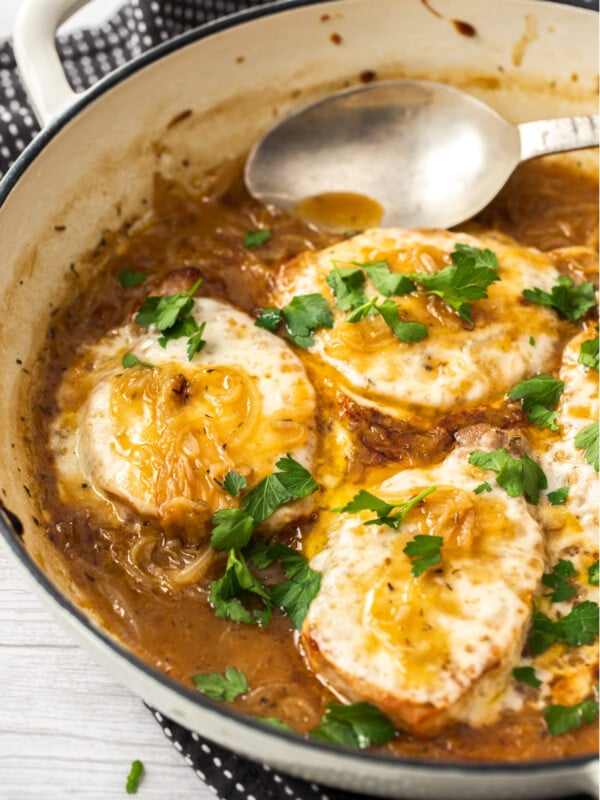 a pan with boneless french onion pork chops