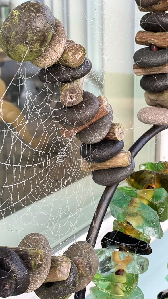 spider webs on a rock sculpture