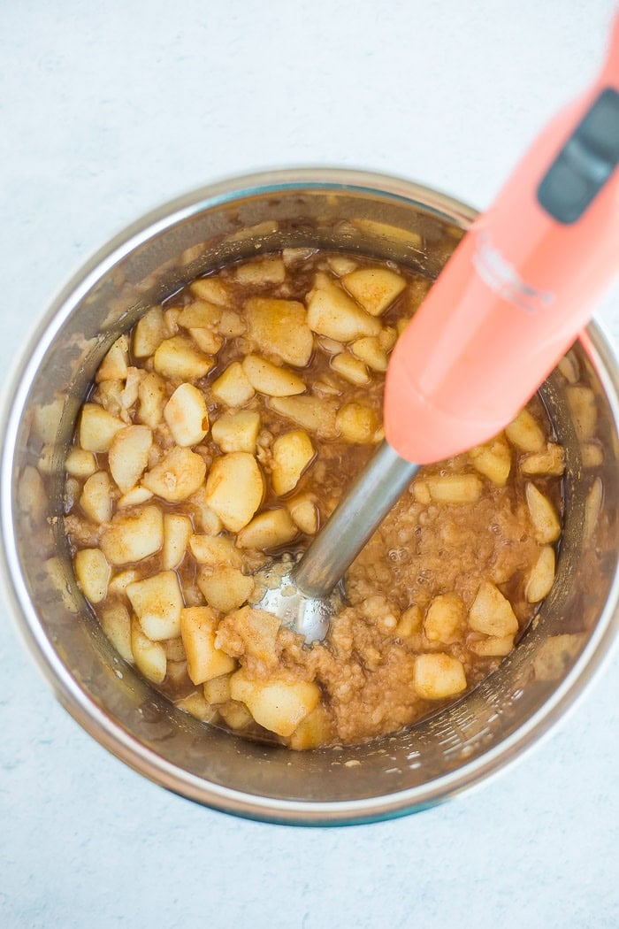 an immersion blender in a slow cooker.