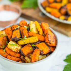 a bowl of air fryer carrots topped with parsley