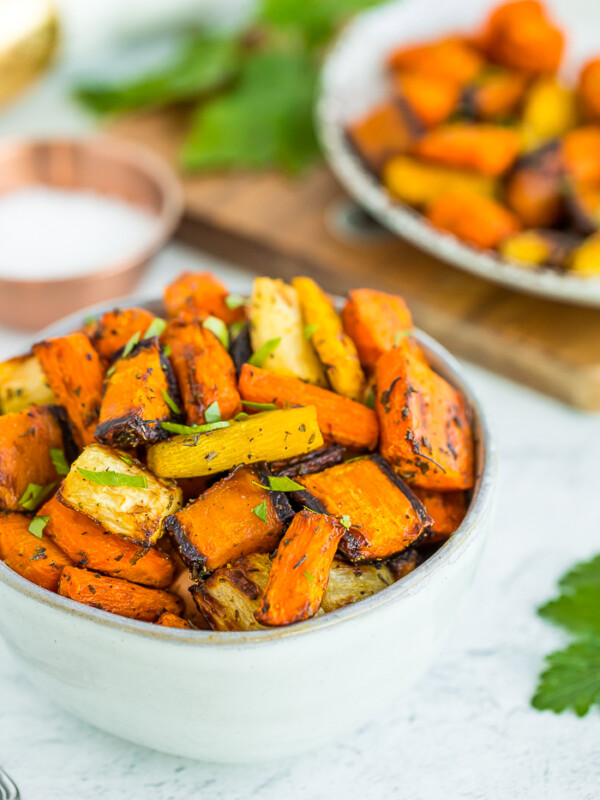 a bowl of air fryer carrots topped with parsley
