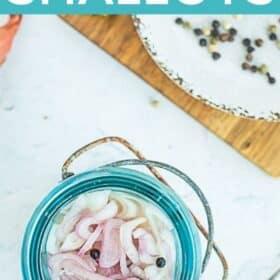 a blue jar with pickled shallots