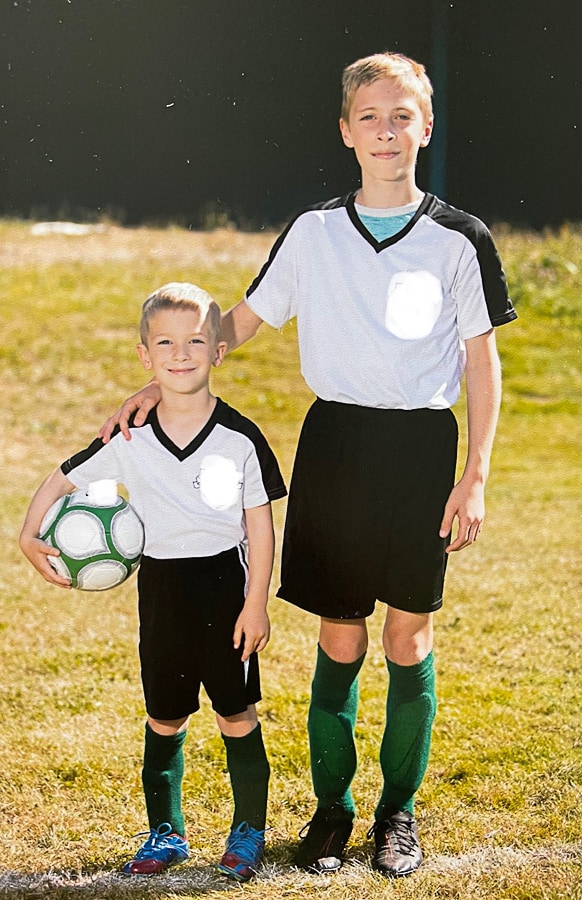 two kids in soccer uniforms