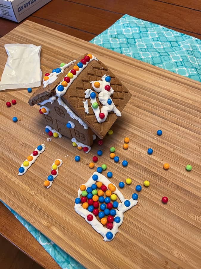 a small gingerbread house covered in candy