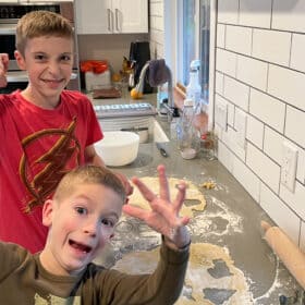 2 boys making Christmas cookies