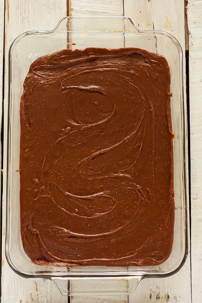 fudge cooling in a glass baking dish.