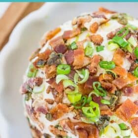 a jalapeno cheeseball topped with crispy bacon and chopped green onions