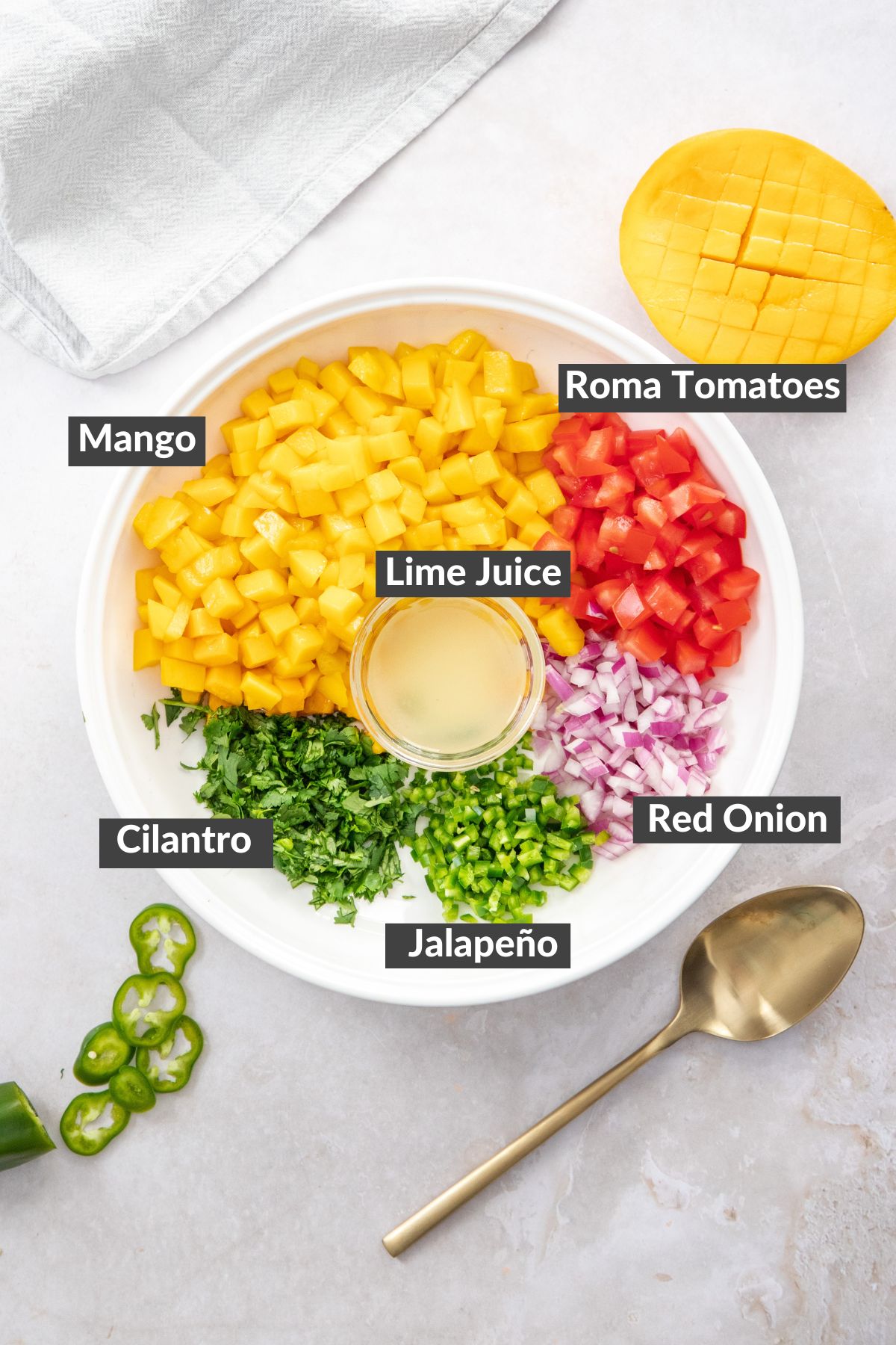 chopped fruit and vegetables in a white salsa dish.